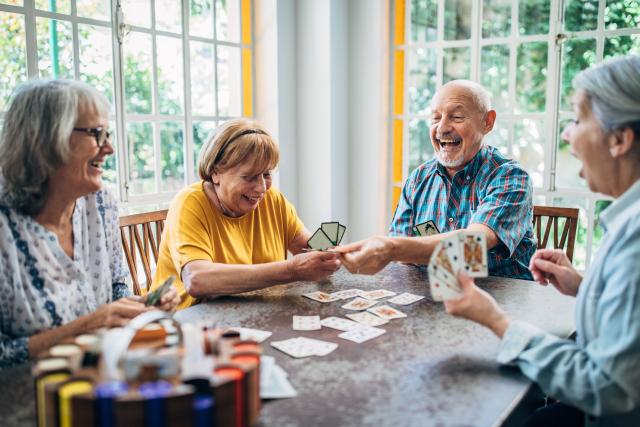 Older adults playing cards together